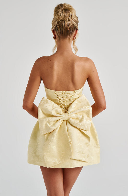 Elenora | Vestido mini de jacquard amarillo con lazo y escote palabra de honor